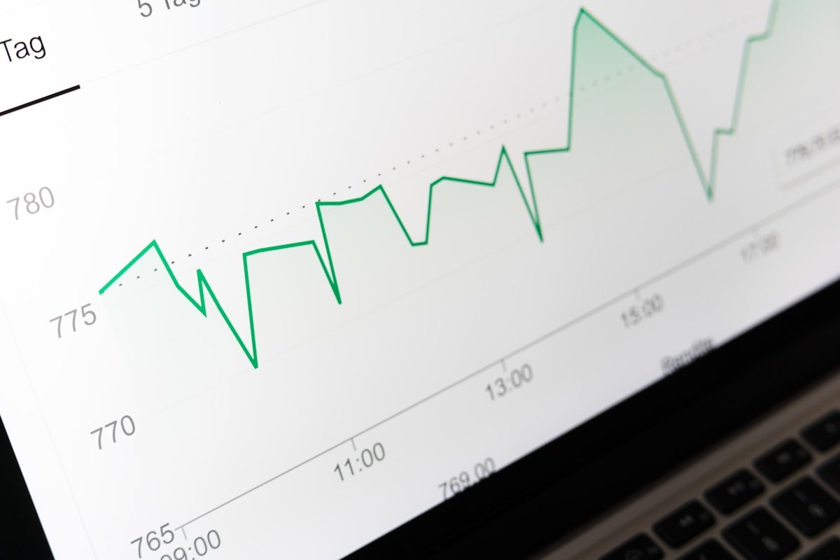 A stock performance chart displayed on a laptop screen